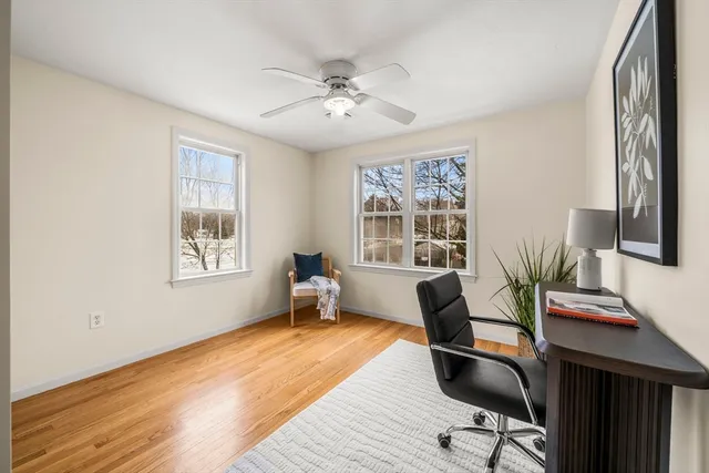 a bedroom with a bed and a chair