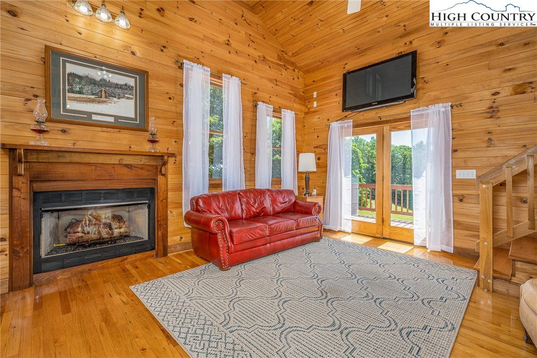 363 Misty Mountain Road Boone, NC 28607 - Photo 18 of 50 a living room with furniture and a fireplace