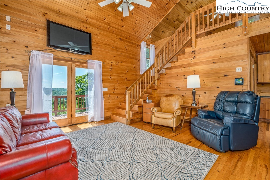 363 Misty Mountain Road Boone, NC 28607 - Photo 19 of 50 a living room with furniture and a flat screen tv