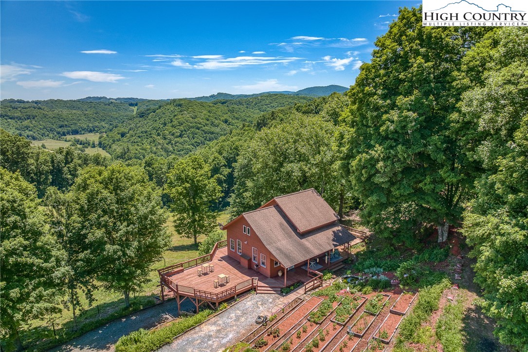 363 Misty Mountain Road Boone, NC 28607 - Photo 2 of 50 a view of a garden with sitting area