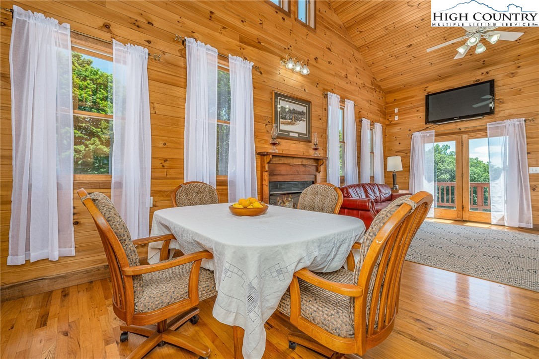 363 Misty Mountain Road Boone, NC 28607 - Photo 22 of 50 a view of a dining room with furniture and windows