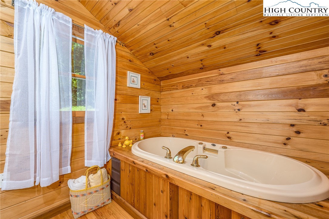 363 Misty Mountain Road Boone, NC 28607 - Photo 39 of 50 a bathroom with a bathtub and shower