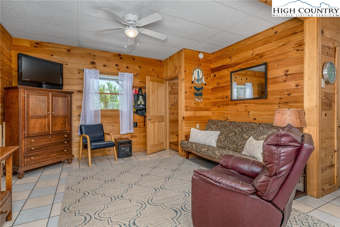 363 Misty Mountain Road Boone, NC 28607 - Photo 41 of 50 a outdoor living space with furniture and a flat screen tv