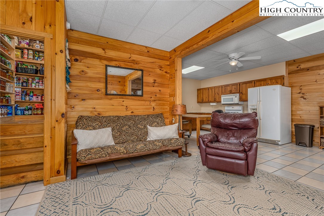 363 Misty Mountain Road Boone, NC 28607 - Photo 42 of 50 a bedroom with furniture and a fireplace
