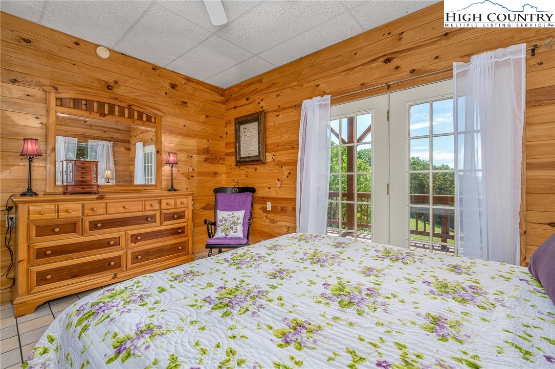363 Misty Mountain Road Boone, NC 28607 - Photo 48 of 50 a bedroom with a bed and a dresser