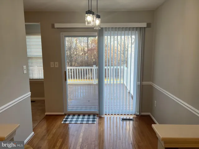 a view of entryway with wooden floor
