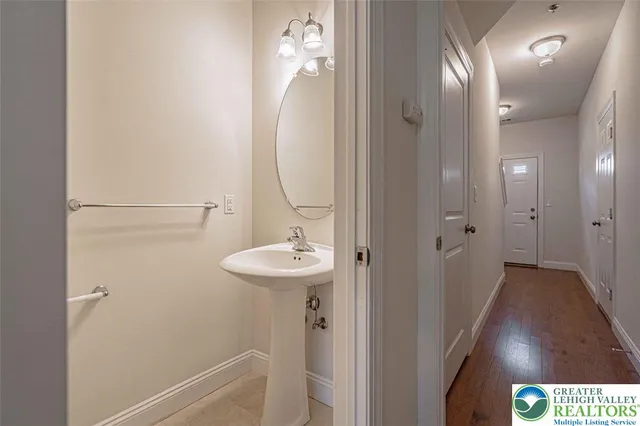 a bathroom with a sink and mirror
