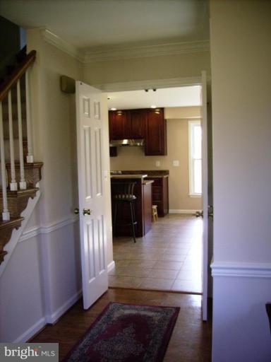 3105 Fallston Road Fallston, MD 21047 - Photo 11 of 30 a kitchen with kitchen island a counter space a sink and a refrigerator