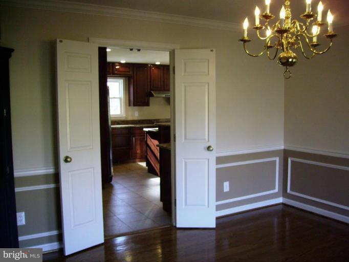 3105 Fallston Road Fallston, MD 21047 - Photo 13 of 30 a view of a hallway with wooden floor and cabinet