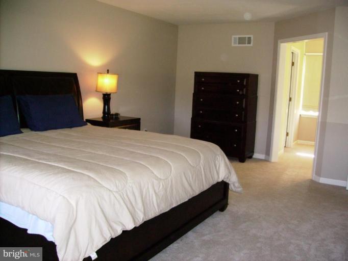 3105 Fallston Road Fallston, MD 21047 - Photo 17 of 30 a bedroom with a bed and a lamp