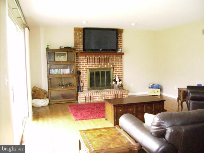 3105 Fallston Road Fallston, MD 21047 - Photo 28 of 30 a living room with furniture a flat screen tv and a fireplace