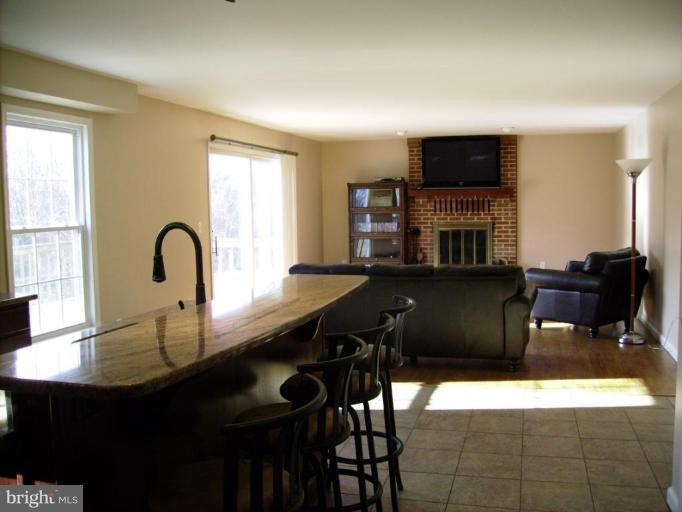 3105 Fallston Road Fallston, MD 21047 - Photo 8 of 30 a kitchen with a table chairs and a sink