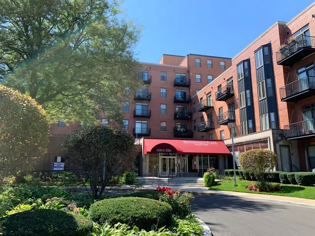 a view of building with street and trees