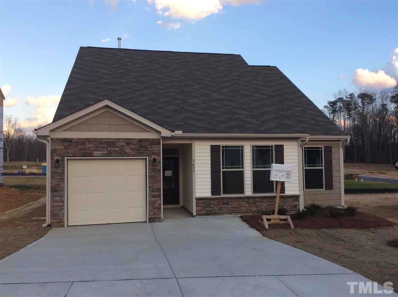 3633 Tule Spring Street Raleigh, NC 27610 - Photo 1 of 10 a front view of a house with garden