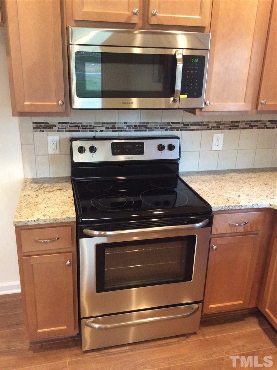 3633 Tule Spring Street Raleigh, NC 27610 - Photo 5 of 10 a stove top oven sitting inside of a kitchen
