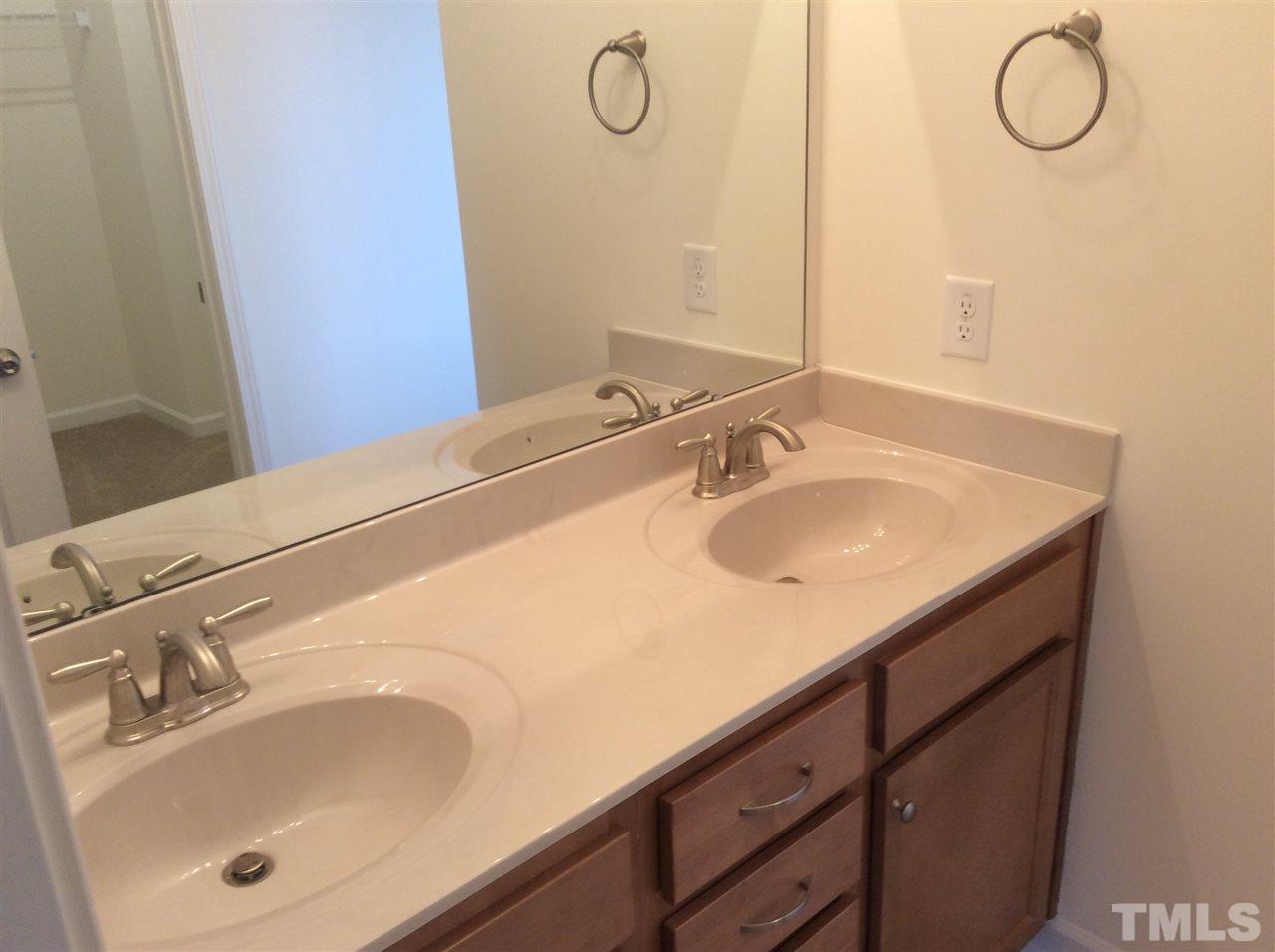 3633 Tule Spring Street Raleigh, NC 27610 - Photo 7 of 10 a bathroom with a sink and a mirror