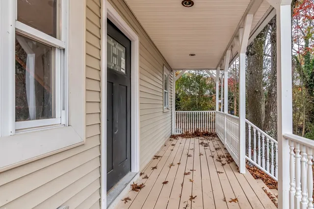 a view of balcony with wooden floor