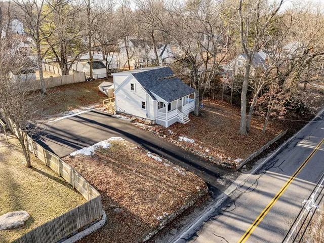 a view of a yard with chairs