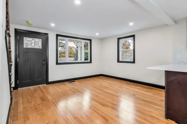 a kitchen with granite countertop a stove and a sink