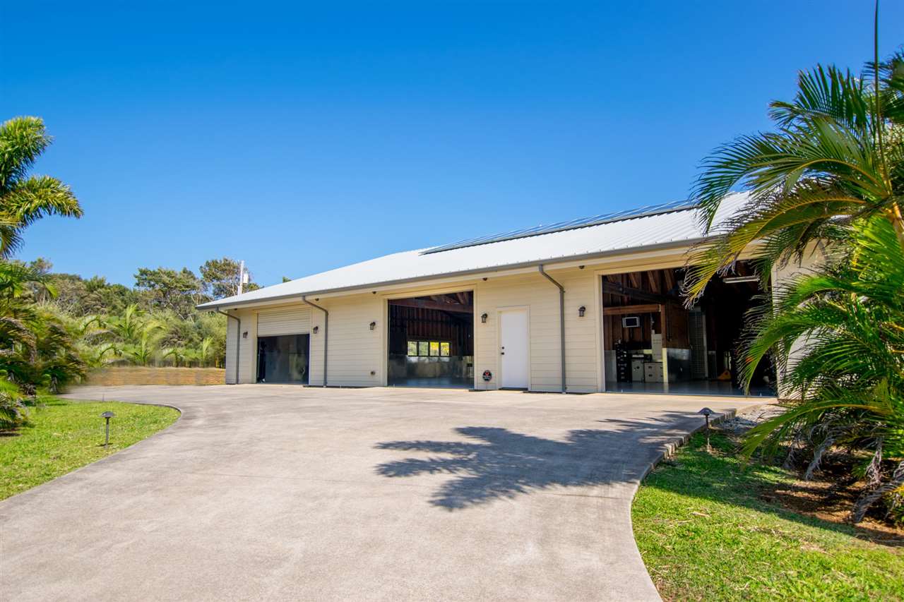 4605 Hana Highway Haiku, HI 96708 - Photo 16 of 30 a front view of a house with garden and trees