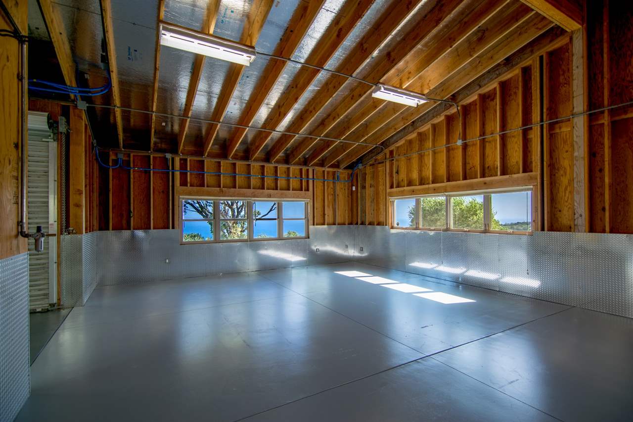 4605 Hana Highway Haiku, HI 96708 - Photo 17 of 30 a view of an empty room with wooden floor