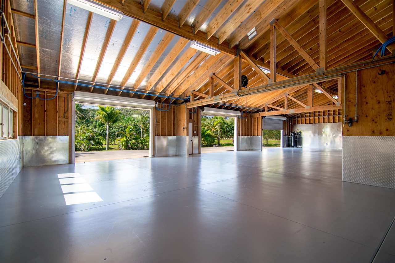 4605 Hana Highway Haiku, HI 96708 - Photo 18 of 30 a view of interior space with wooden floor and windows