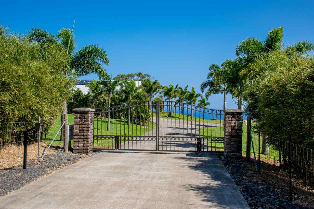 4605 Hana Highway Haiku, HI 96708 - Photo 6 of 30 a view of a fence with a flower garden