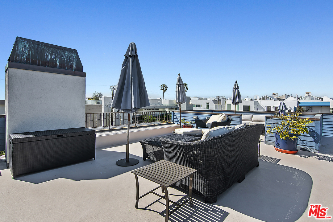 21 Westwind Street Marina del Rey, CA 90292 - Photo 15 of 52 a view of roof deck with outdoor seating and city view