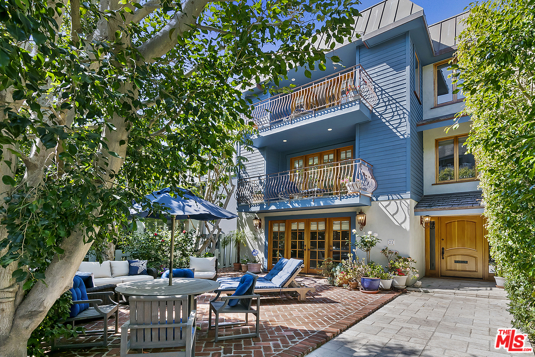 21 Westwind Street Marina del Rey, CA 90292 - Photo 3 of 52 a view of a cafe with a table and chairs under an umbrella
