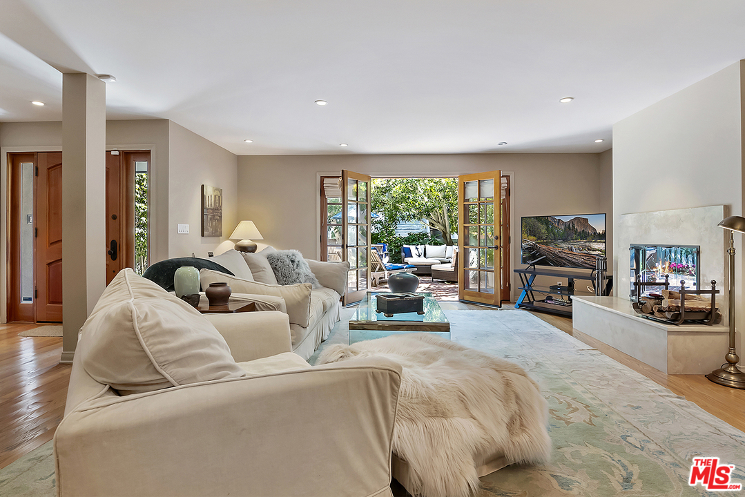 21 Westwind Street Marina del Rey, CA 90292 - Photo 23 of 52 a living room with furniture large window and a flat screen tv