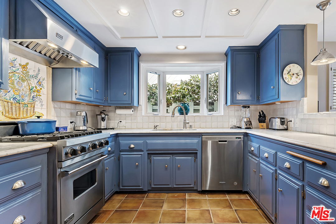 21 Westwind Street Marina del Rey, CA 90292 - Photo 29 of 52 a kitchen with a sink a stove and cabinets