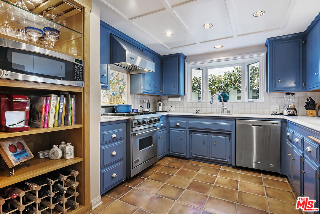 21 Westwind Street Marina del Rey, CA 90292 - Photo 30 of 52 a kitchen with stainless steel appliances granite countertop a stove a sink and a refrigerator