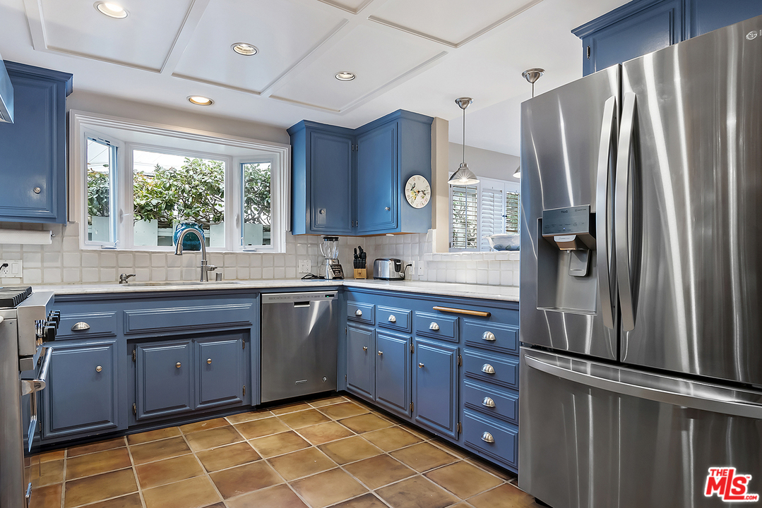 21 Westwind Street Marina del Rey, CA 90292 - Photo 32 of 52 a kitchen with stainless steel appliances granite countertop a refrigerator and a sink