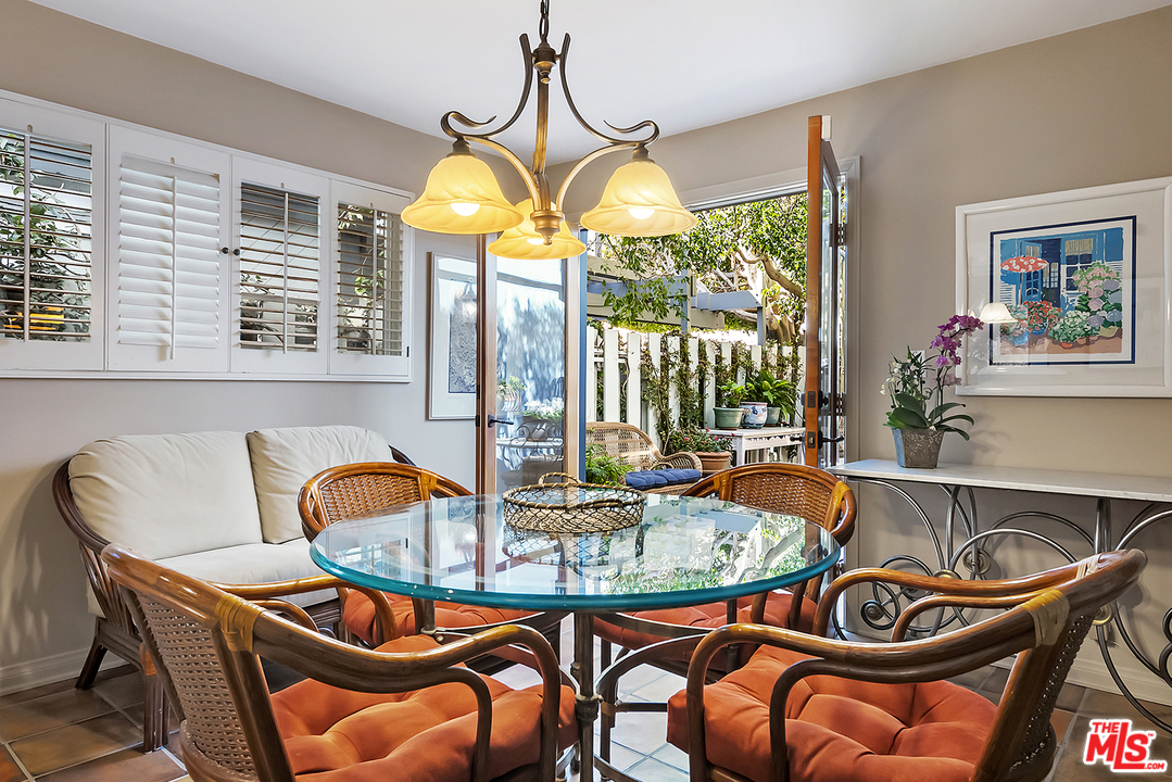 21 Westwind Street Marina del Rey, CA 90292 - Photo 33 of 52 a dining room with furniture and a large window