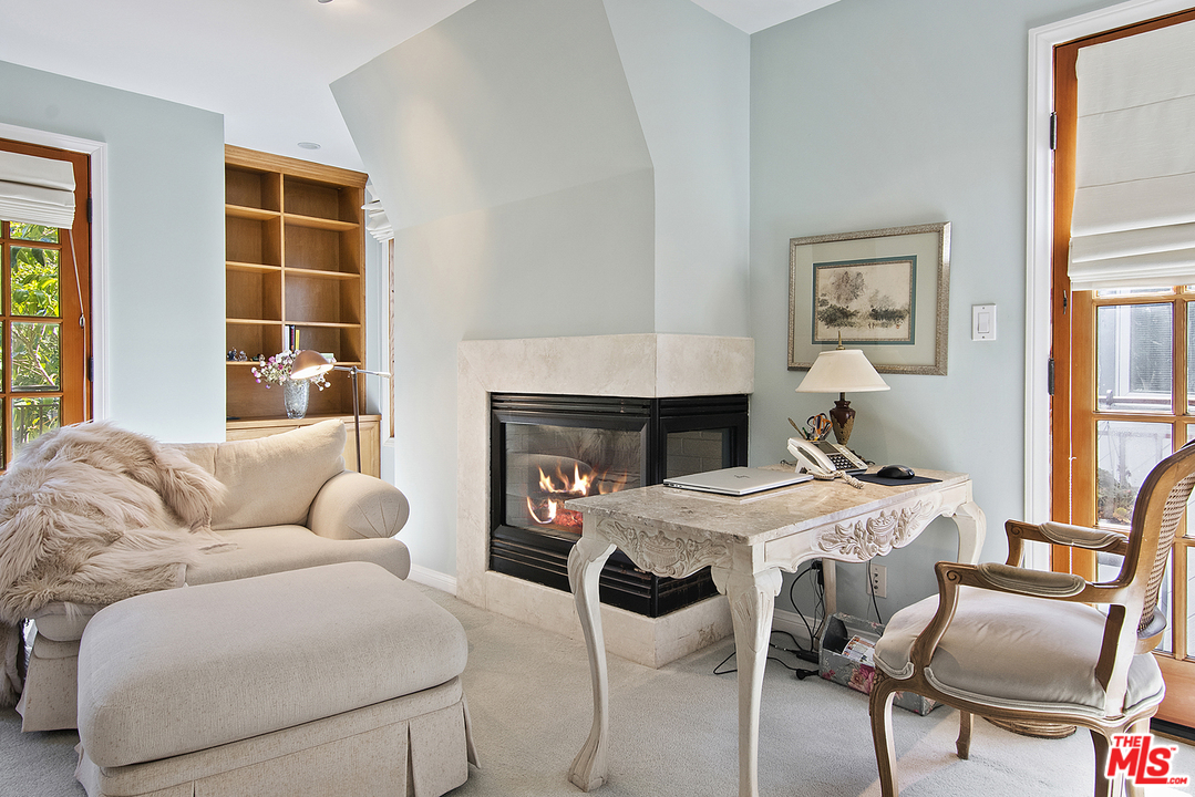 21 Westwind Street Marina del Rey, CA 90292 - Photo 41 of 52 a bedroom with furniture and a fireplace