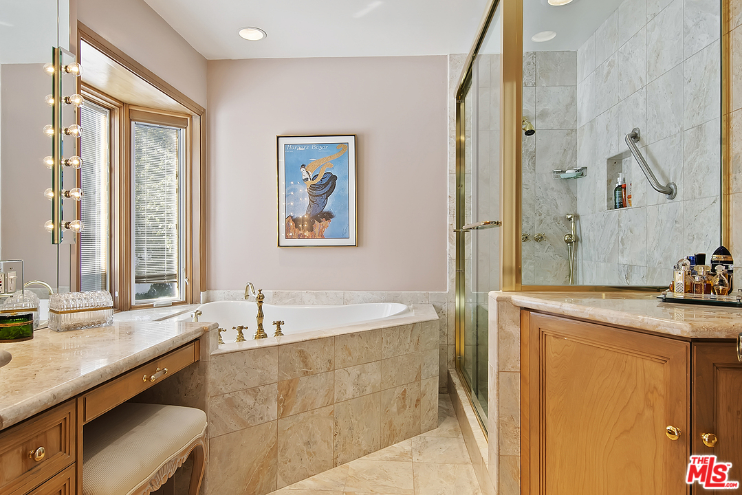 21 Westwind Street Marina del Rey, CA 90292 - Photo 43 of 52 a spacious bathroom with a granite countertop sink a mirror a bathtub and shower