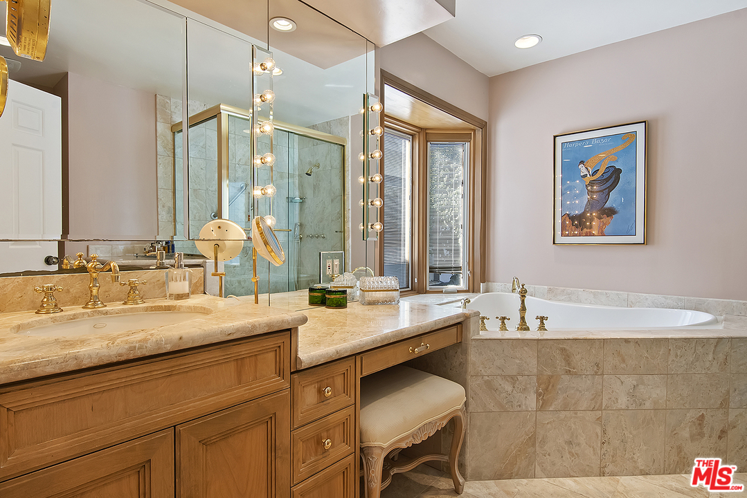 21 Westwind Street Marina del Rey, CA 90292 - Photo 44 of 52 a bathroom with a granite countertop sink mirror and a bathtub
