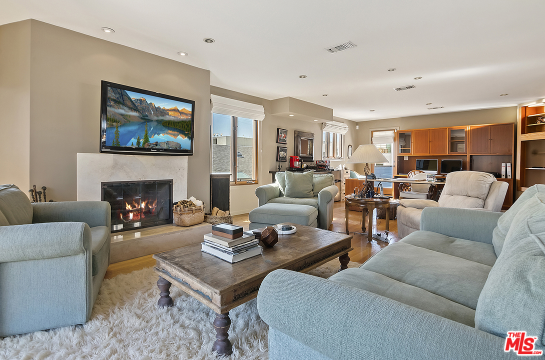 21 Westwind Street Marina del Rey, CA 90292 - Photo 51 of 52 a living room with furniture fireplace and a large window