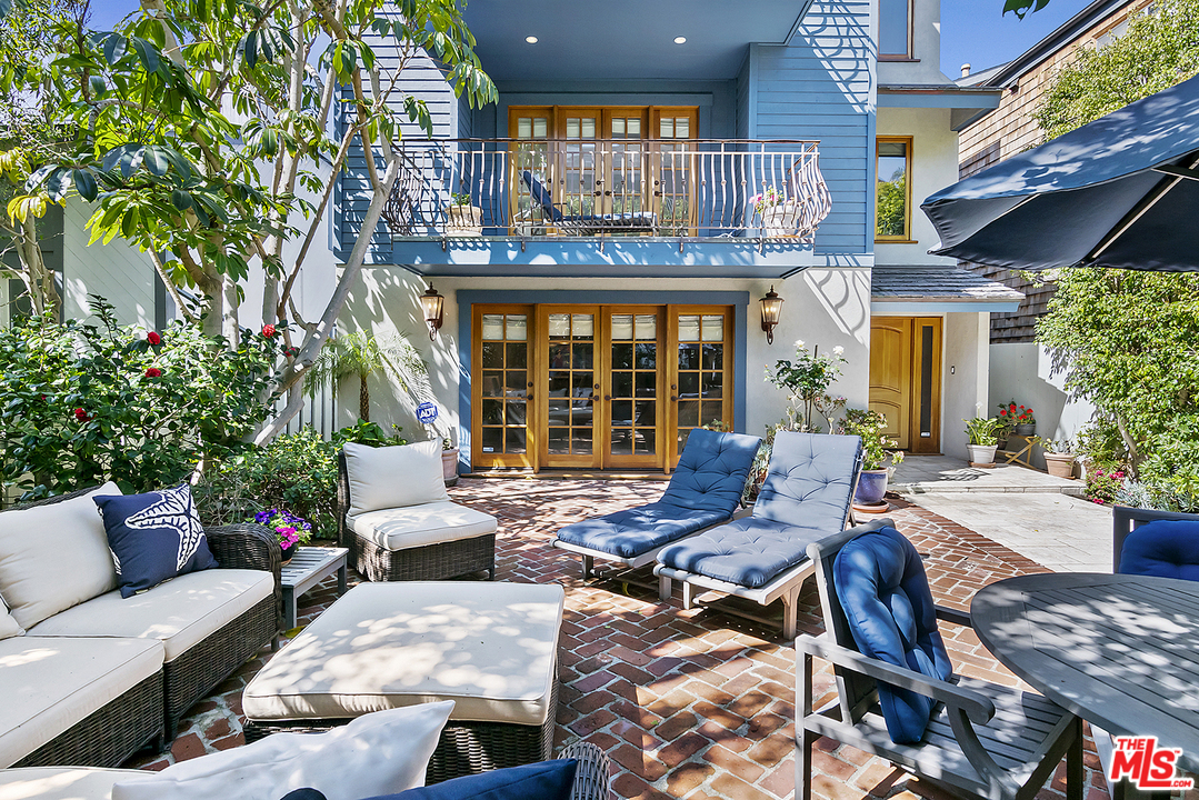 21 Westwind Street Marina del Rey, CA 90292 - Photo 7 of 52 a view of a patio with couches table and chairs and potted plants
