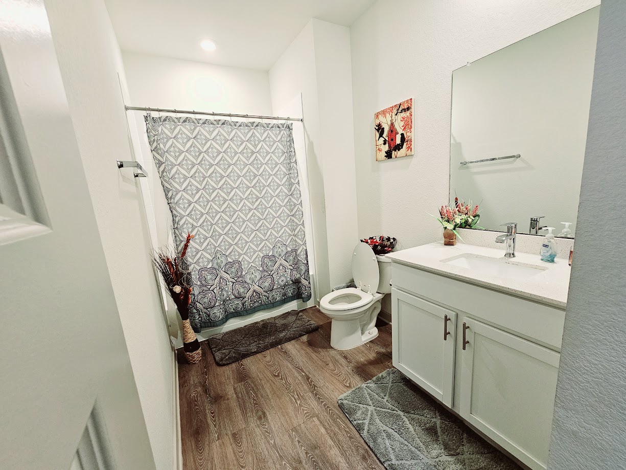 121 Merrick Road Georgetown, TX 78628 - Photo 14 of 29 a bathroom with a sink toilet and shower