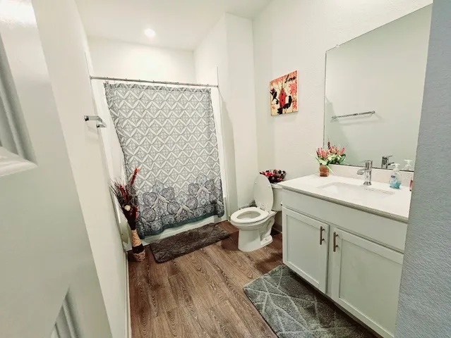a kitchen with sink and refrigerator