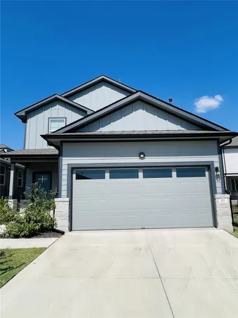 a front view of a house with a garage