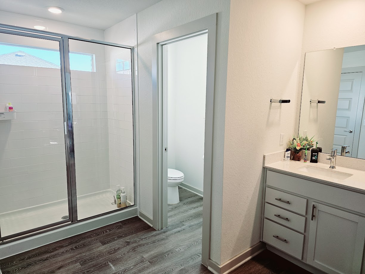 121 Merrick Road Georgetown, TX 78628 - Photo 20 of 29 a bathroom with a shower sink and toilet