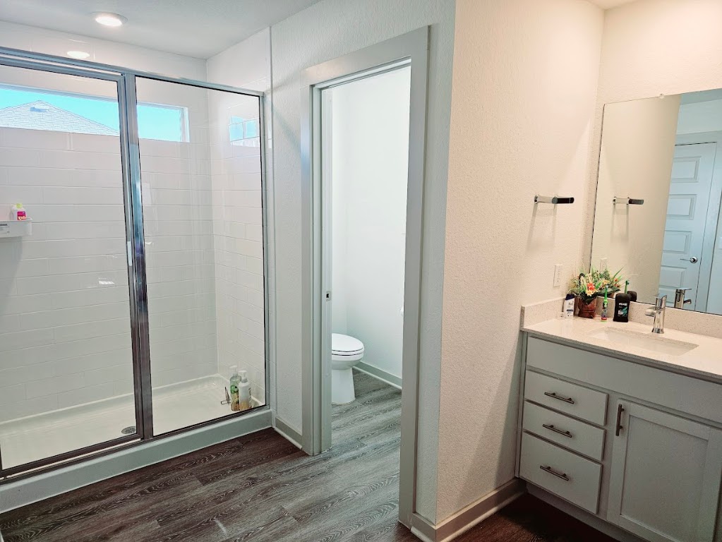 121 Merrick Road Georgetown, TX 78628 - Photo 20 of 29 a bathroom with a shower sink and toilet