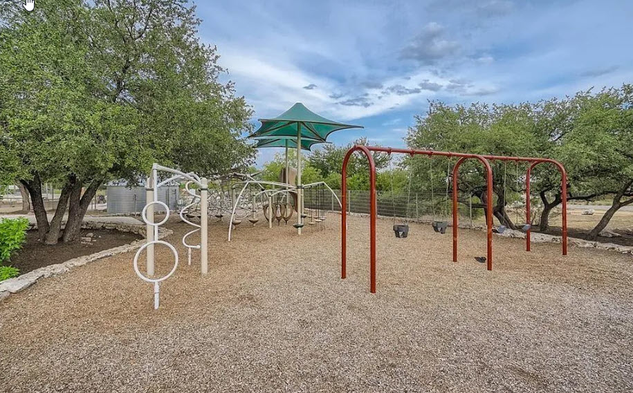 121 Merrick Road Georgetown, TX 78628 - Photo 26 of 29 a backyard of a house with table and chairs