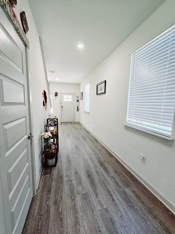 121 Merrick Road Georgetown, TX 78628 - Photo 6 of 29 a view of a hallway with a livingroom and furniture