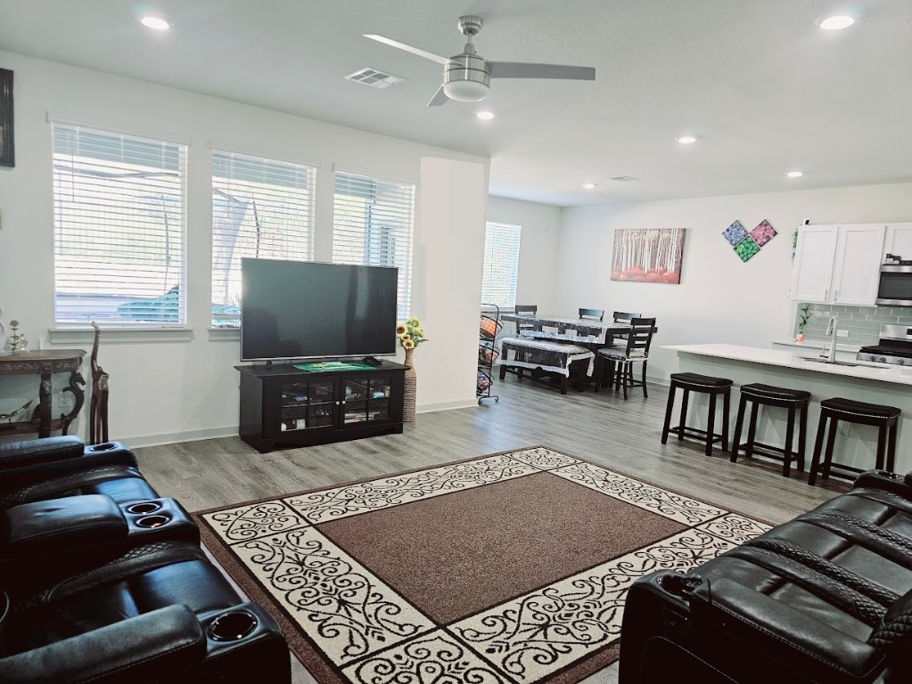 121 Merrick Road Georgetown, TX 78628 - Photo 7 of 29 a living room with furniture and a flat screen tv