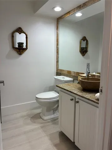 a bed room with a bed and a chandelier