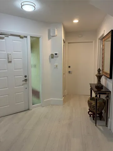 a view of a livingroom with a window and a ceiling fan