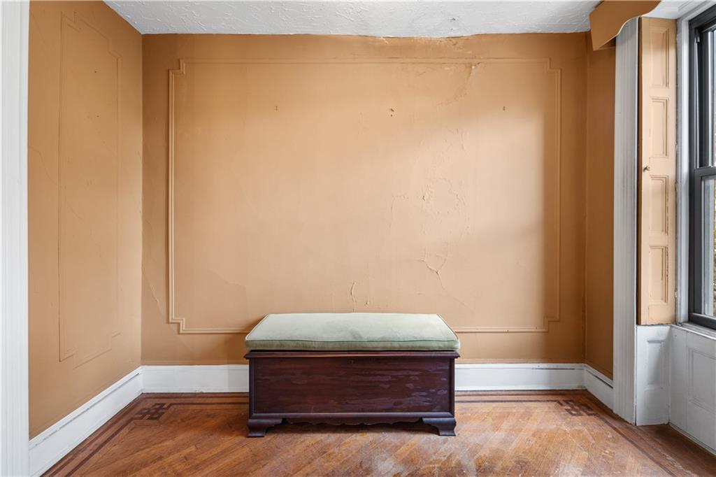 484 Decatur Street Brooklyn, NY 11233 - Photo 16 of 23 a room with a door
